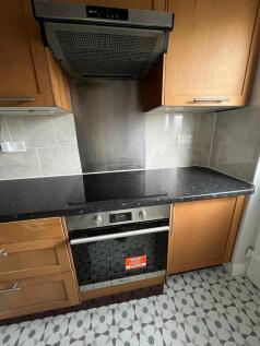 Modern fitted kitchen with built-in oven, extra...