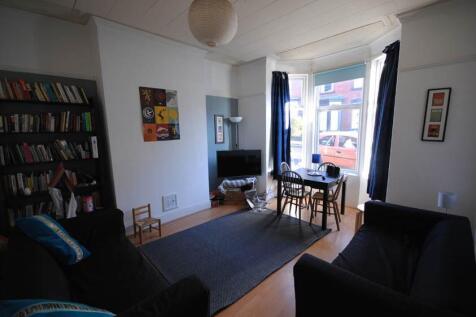 A bright and inviting living room with plenty o...