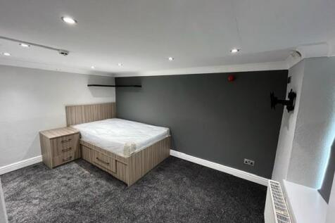 A well-maintained bedroom featuring a double be...