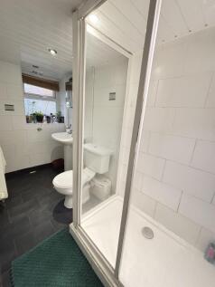 Bright and well-maintained bathroom with a spac...
