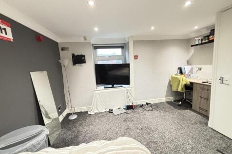 A bright and comfortable living room with ample...