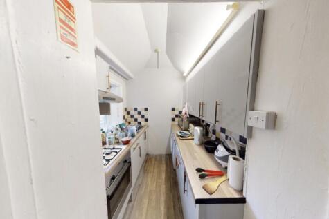 A well-maintained kitchen with ample workspace ...