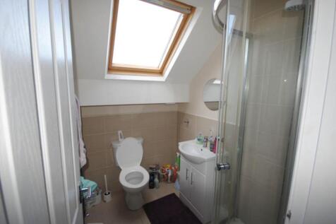 Bright and clean bathroom featuring a large win...