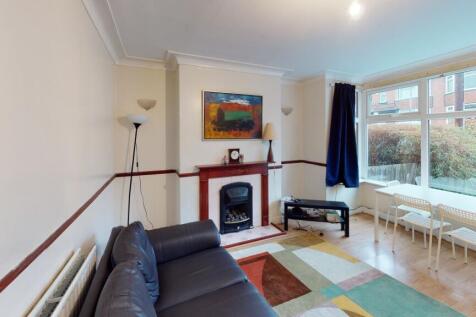 A bright and welcoming living room featuring am...