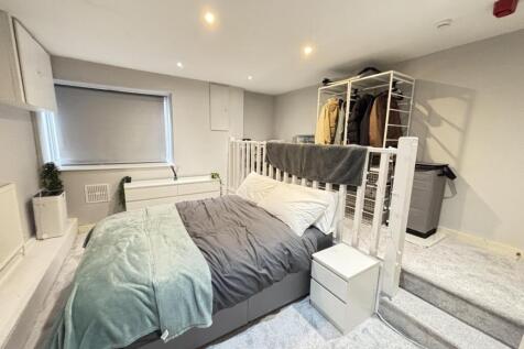 A spacious and well-maintained master bedroom f...