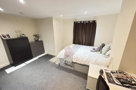 A spacious and well-maintained master bedroom f...