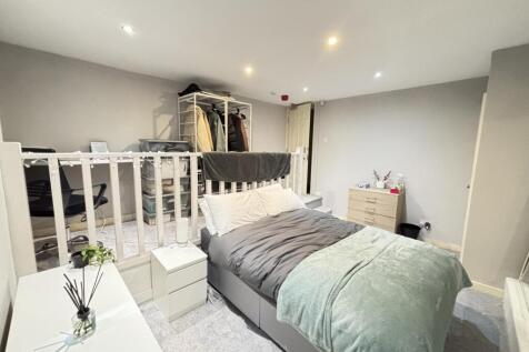 Bright and spacious double bedroom featuring a ...