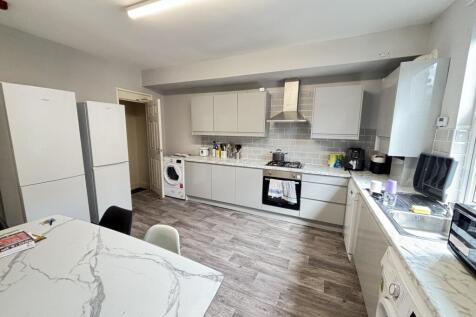 Bright and modern kitchen with ample natural li...