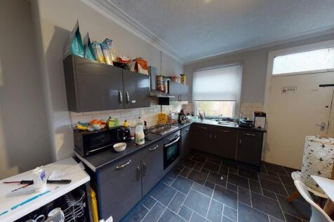 Bright and modern kitchen with ample natural li...