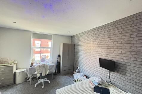 Bright and welcoming living room with natural l...