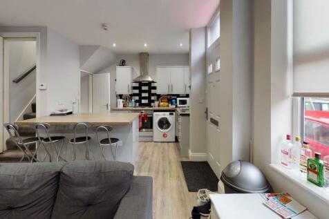 Bright and spacious living room featuring moder...