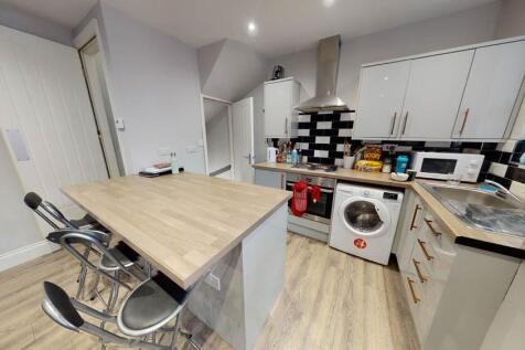 Bright and modern kitchen with ample workspace,...