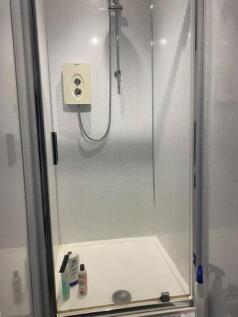 A clean and well-maintained bathroom with a spa...