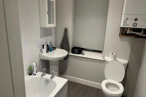 A clean and well-maintained bathroom featuring ...