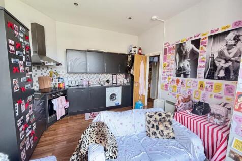 A cozy and well-decorated living room featuring...