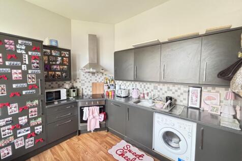 Bright and well-maintained kitchen with modern ...