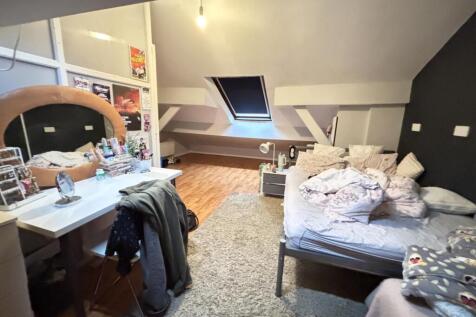 A cozy living room with a sofa, a coffee table,...