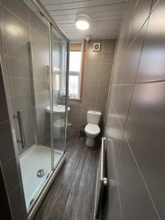 A bright and functional bathroom with a shower ...