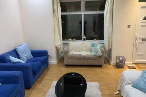 A bright and welcoming living room featuring a ...