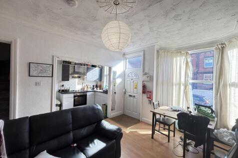 Bright and welcoming living room featuring comf...