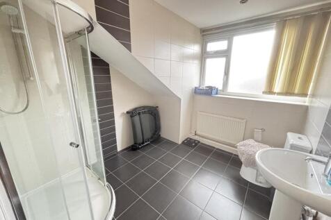 Bright and spacious bathroom with a large windo...