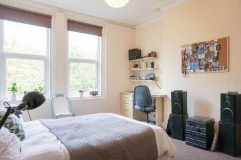 A bright and inviting bedroom filled with natur...