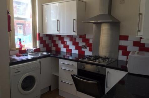 A bright and tidy kitchen featuring modern appl...