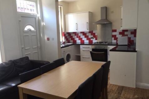 A well-lit kitchen with modern appliances, ampl...