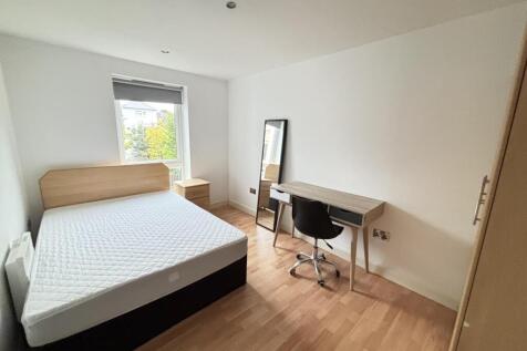 Bright and spacious master bedroom featuring a ...