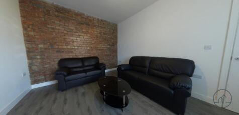 A spacious and modern living room featuring com...