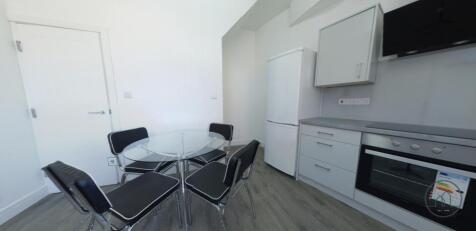 A modern, well-maintained kitchen area featurin...