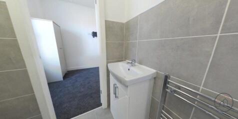 A clean and well-maintained bathroom featuring ...