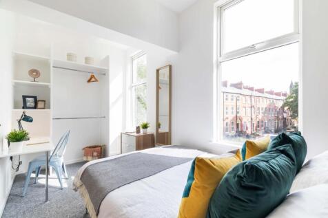 Bright and spacious master bedroom featuring a ...