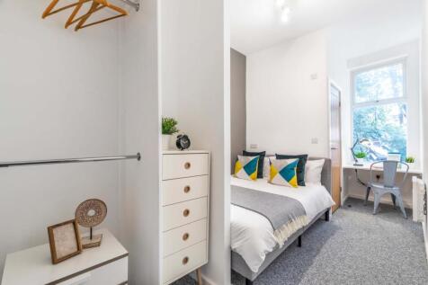 A bright and welcoming double bedroom featuring...