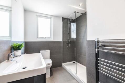 A modern, well-maintained bathroom featuring a ...
