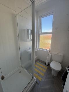 A bright and clean bathroom featuring a modern ...