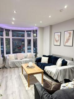 Bright and modern living room with stylish deco...