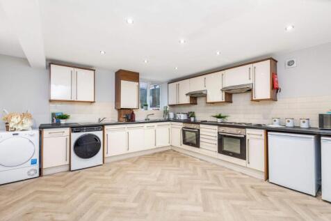 Bright and modern kitchen with ample counter sp...