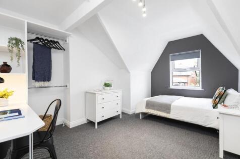 Bright and airy student bedroom featuring a spa...