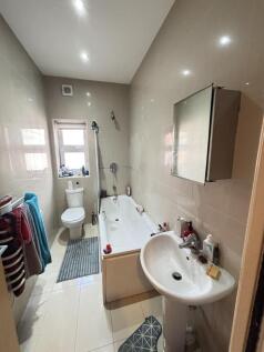 A clean and well-maintained bathroom featuring ...