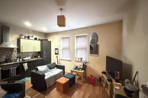 A cozy and inviting living room with comfortabl...