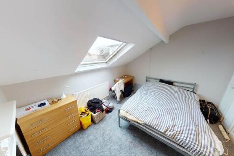 Bright and welcoming bedroom with ample natural...