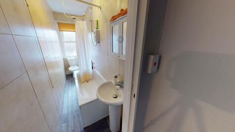 A clean, well-maintained bathroom featuring a s...