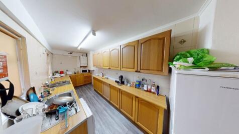 A well-equipped kitchen with ample cabinetry an...