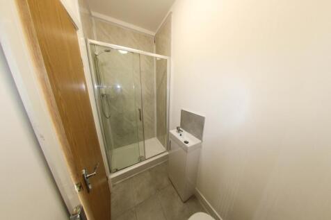 A clean and well-maintained bathroom with a sho...