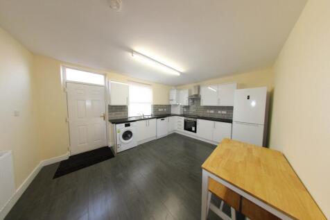 Bright and functional kitchen with ample storag...