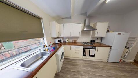 Bright and functional kitchen with ample natura...