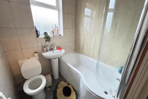 A clean and well-maintained bathroom with a spa...