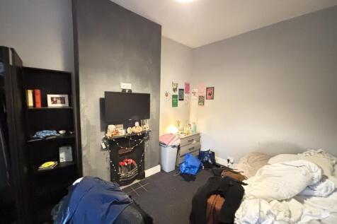 A comfortable bedroom with a cozy atmosphere, f...