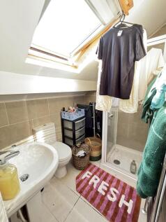 Bright and clean bathroom with a shower cubicle...